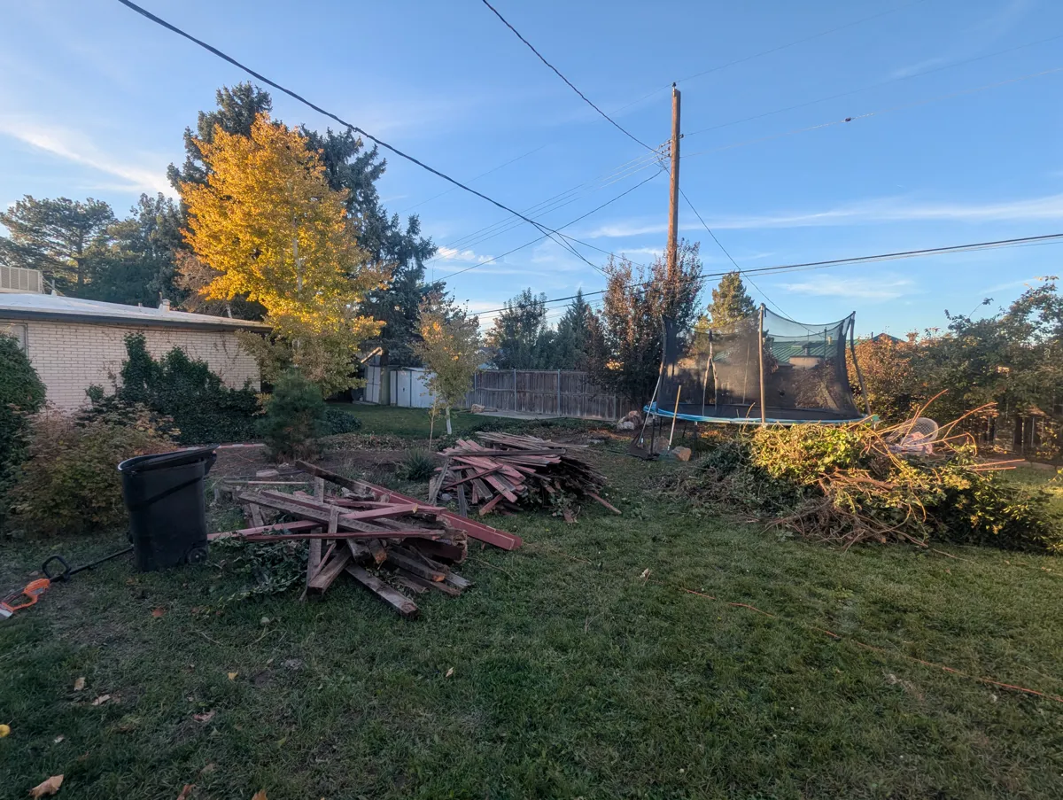 Pre-build — debris pile, dead trampoline, no boundary