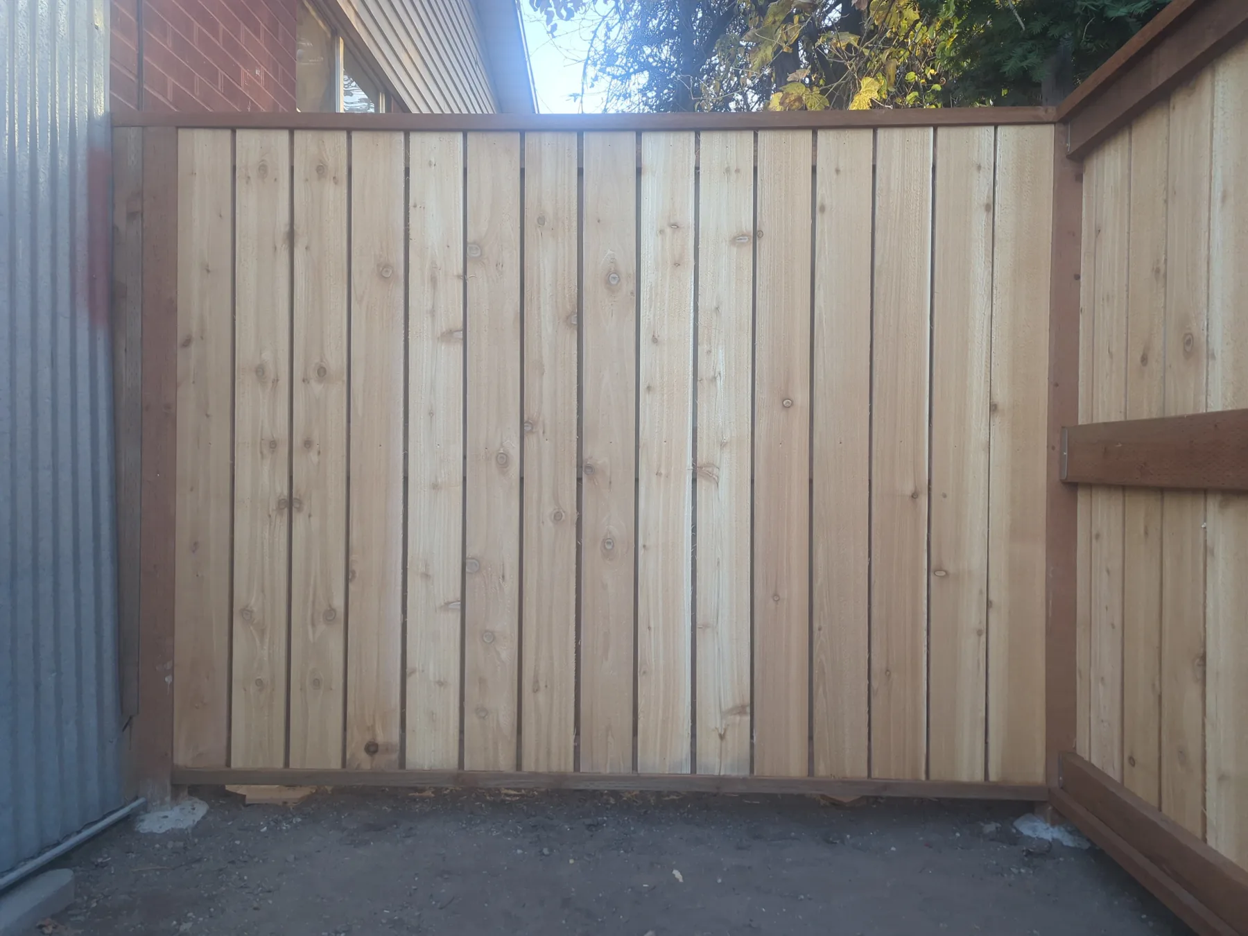New cedar panel — clean vertical boards, dark trim frame